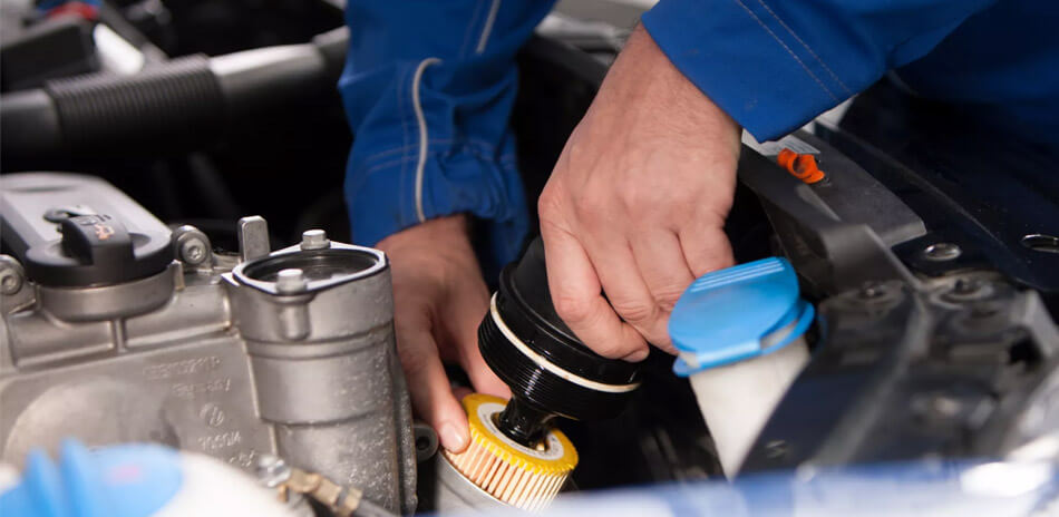A man working on a VW Golf rear brakes