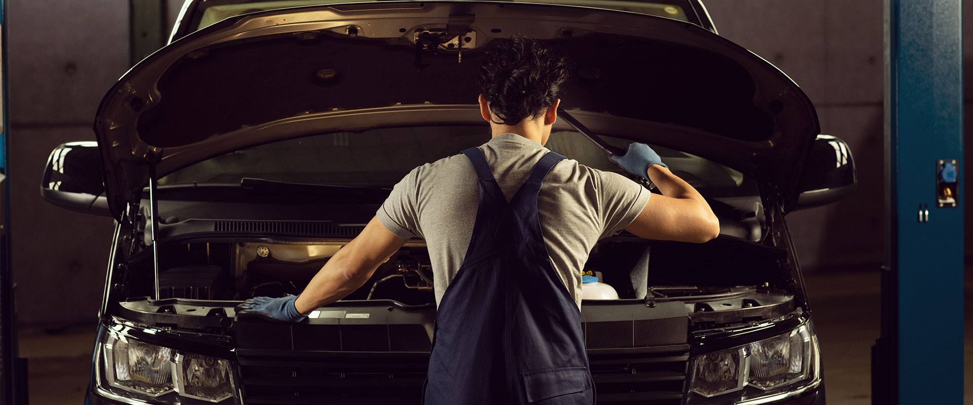 Back VW technician working on a Volkswagen